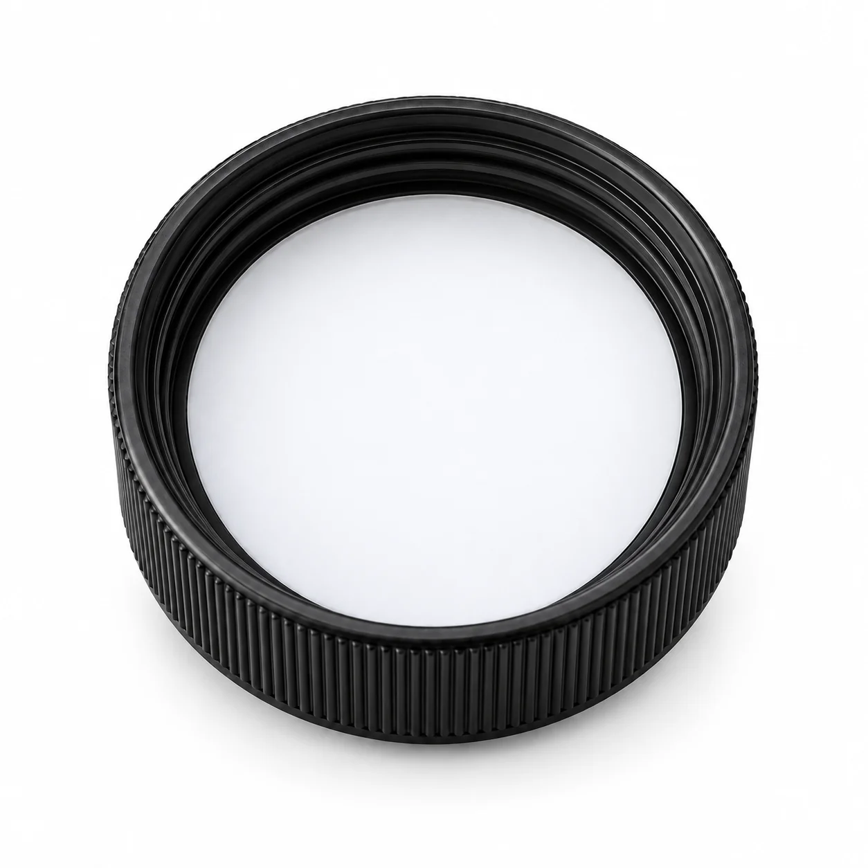 Underside of a black lid showing its white PTFE liner contact surface